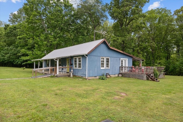 7158 Bahne Rd, Fairview, TN 37062 - view of front of property featuring a front yard, a deck, and metal roof