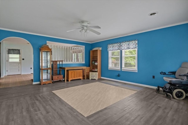 7158 Bahne Rd, Fairview, TN 37062 - living room featuring arched walkways, ceiling fan, wood finished floors, baseboards, and ornamental molding