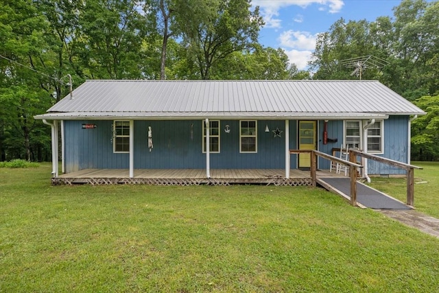 7158 Bahne Rd, Fairview, TN 37062 - single story home with metal roof, a front lawn, covered porch, and view of scattered trees