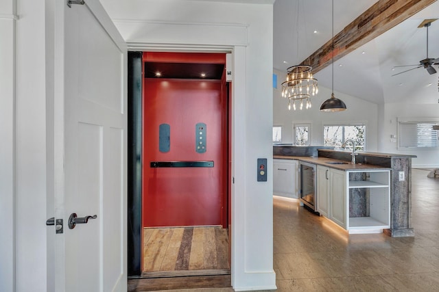 3910 Brick Church Pike, Nashville, TN 37207 - kitchen with beverage cooler, a ceiling fan, a sink, open shelves, and dark countertops
