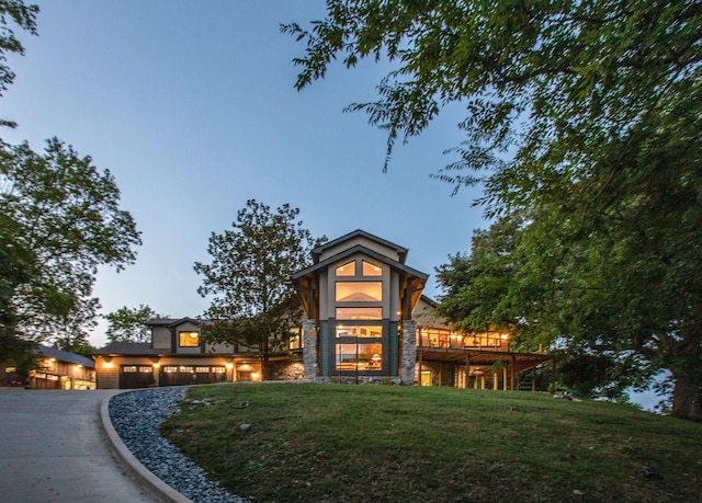 3910 Brick Church Pike, Nashville, TN 37207 - view of front facade featuring a front lawn, stone siding, and a wooden deck