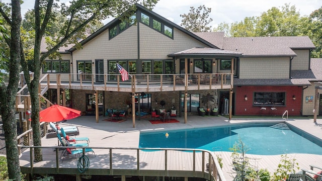 3910 Brick Church Pike, Nashville, TN 37207 - back of house with a deck, an outdoor pool, and a patio area