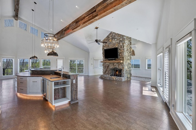 3910 Brick Church Pike, Nashville, TN 37207 - kitchen with high vaulted ceiling, beam ceiling, ceiling fan, a stone fireplace, and open floor plan