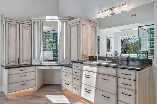 3910 Brick Church Pike, Nashville, TN 37207 - bathroom with plenty of natural light, vanity, wood finished floors, and a shower