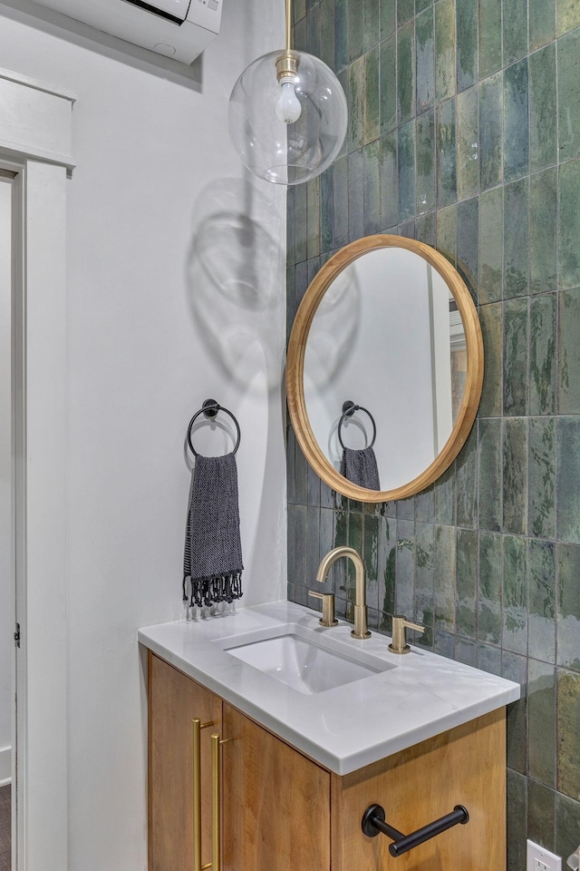 3910 Brick Church Pike, Nashville, TN 37207 - bathroom featuring vanity, backsplash, and tile walls