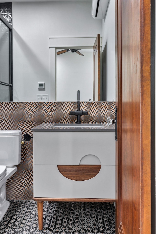 3910 Brick Church Pike, Nashville, TN 37207 - bathroom featuring toilet, tasteful backsplash, and vanity