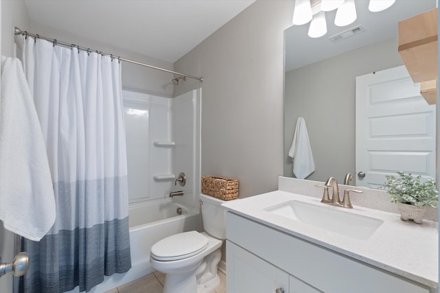 full bathroom with tile patterned floors, toilet, vanity, and shower / bath combo
