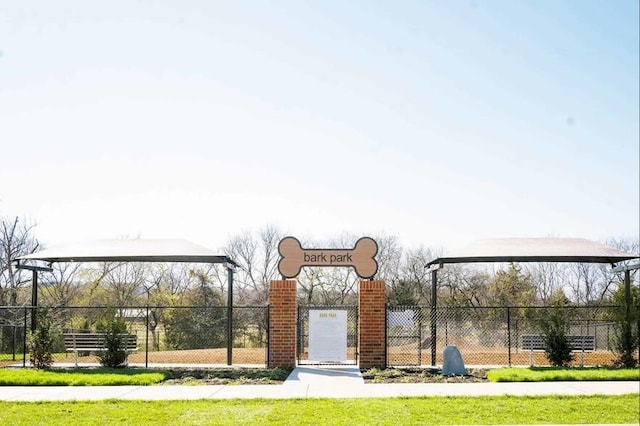 view of home's community with fence