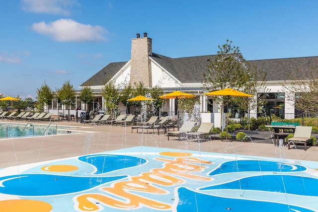 view of home's community featuring a patio, a pool, and fence