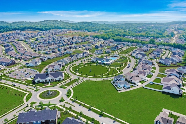 aerial view of property and surrounding area with nearby suburban area and mountains