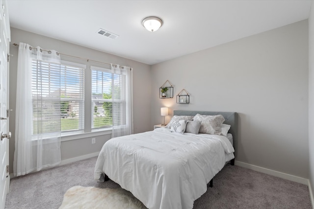 bedroom featuring carpet floors and baseboards