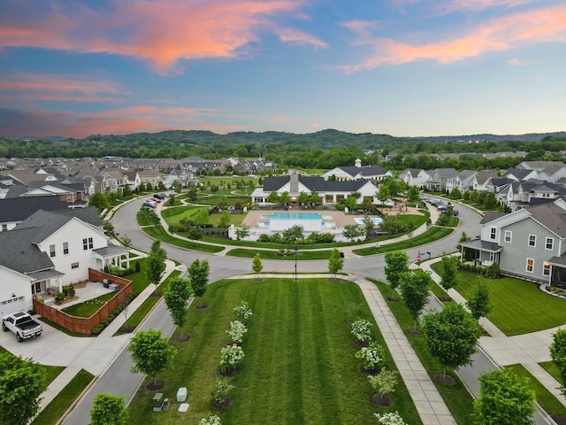aerial view of residential area with a pool