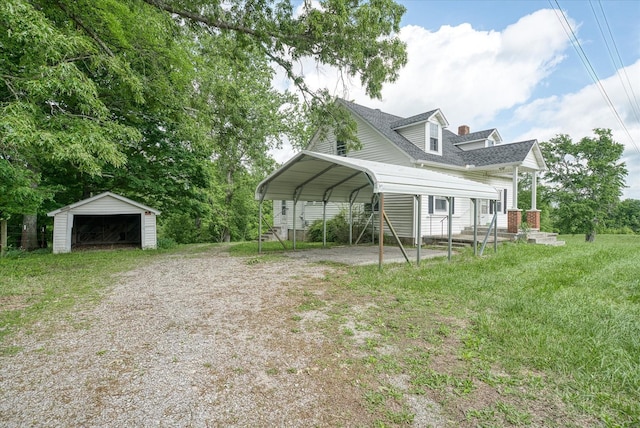 exterior space with an outbuilding, a detached carport, driveway, a garage, and a shingled roof