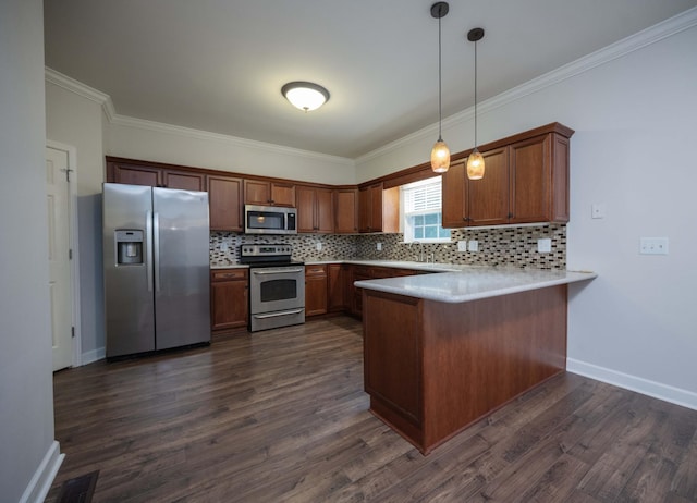 kitchen featuring appliances with stainless steel finishes, a peninsula, baseboards, decorative backsplash, and ornamental molding