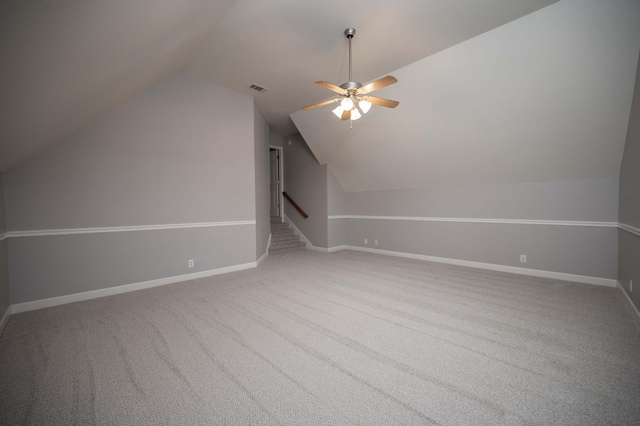 additional living space featuring lofted ceiling, ceiling fan, carpet floors, and baseboards