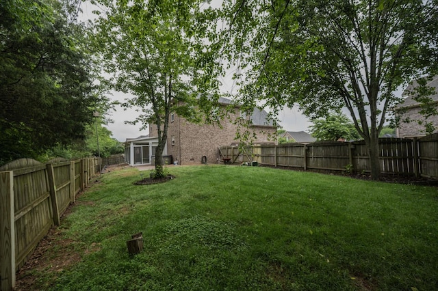 view of yard featuring a sunroom
