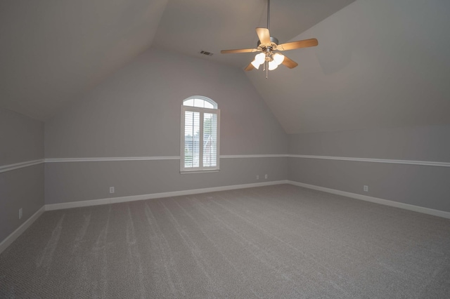 additional living space featuring vaulted ceiling, baseboards, carpet floors, and ceiling fan