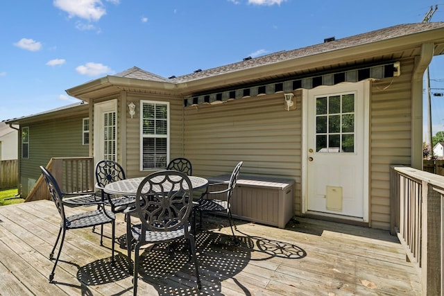wooden deck featuring outdoor dining area