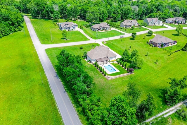 aerial view of residential area featuring a pool