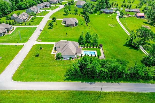 aerial view of residential area featuring a pool