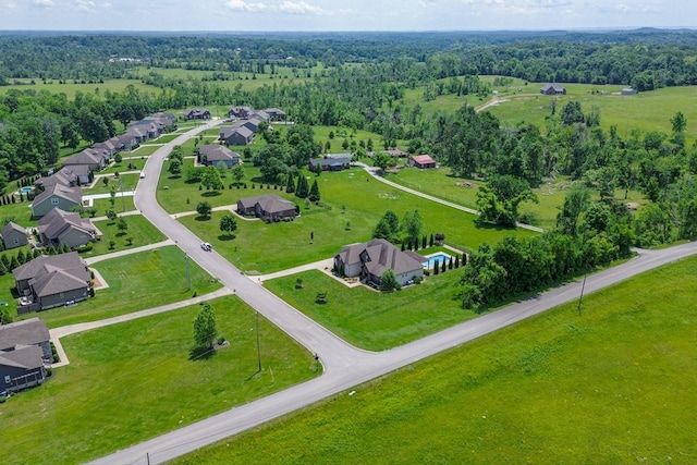 aerial perspective of suburban area with a heavily wooded area