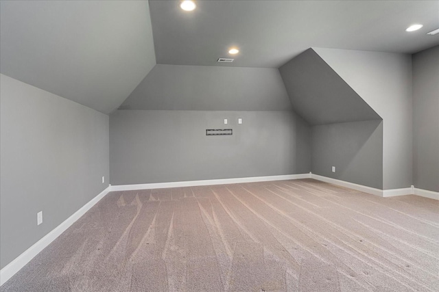 additional living space with lofted ceiling, recessed lighting, carpet floors, and baseboards