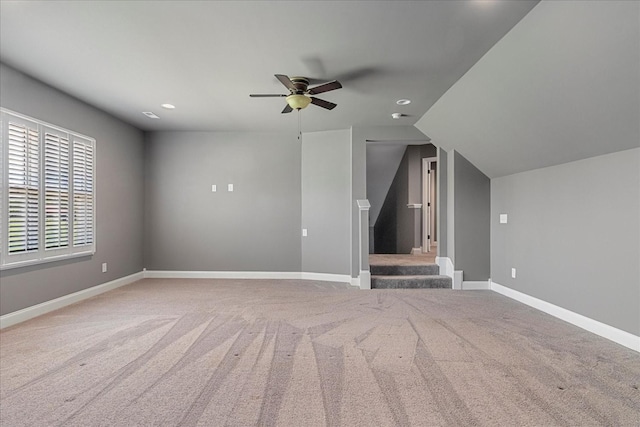 bonus room featuring a ceiling fan, carpet flooring, baseboards, recessed lighting, and stairs