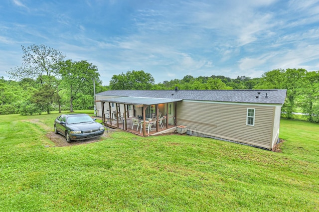 1687 Columbia Rock Rd, Columbia, TN 38401 - back of house featuring a yard, view of scattered trees, and roof with shingles