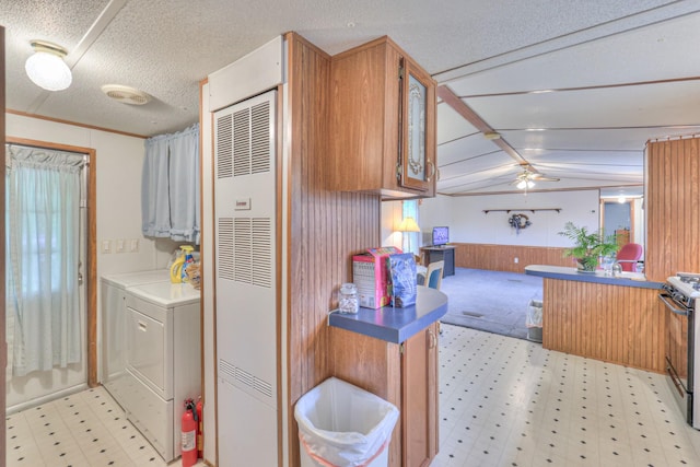 1687 Columbia Rock Rd, Columbia, TN 38401 - clothes washing area featuring a heating unit, light flooring, wooden walls, ceiling fan, and washer and clothes dryer