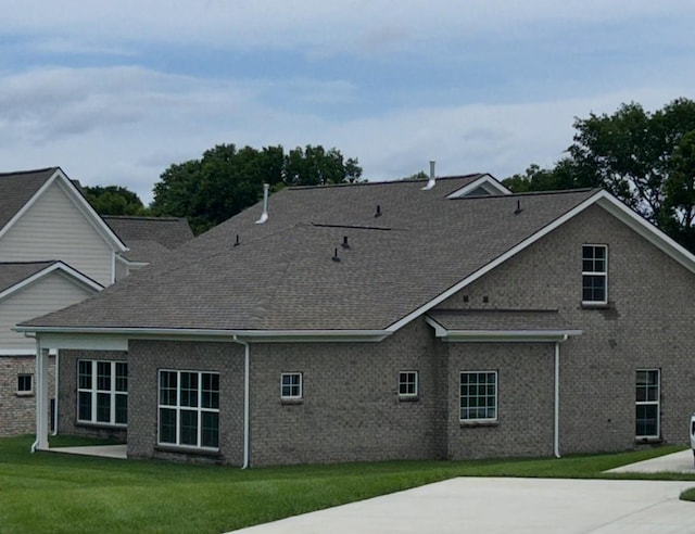 6158 Worthingtion Rd, Columbia, TN 38401 - back of house featuring a lawn, a patio area, brick siding, and a shingled roof