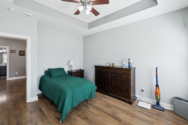 589 Smoky Mountains Dr, Gallatin, TN 37066 - bedroom with a tray ceiling, hardwood / wood-style flooring, baseboards, and a ceiling fan