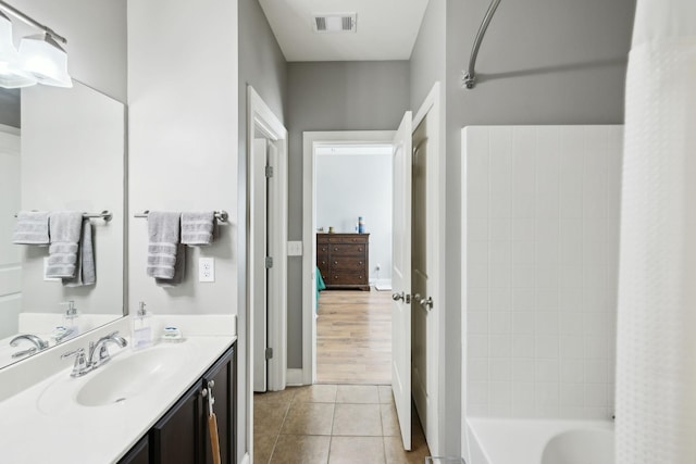 589 Smoky Mountains Dr, Gallatin, TN 37066 - full bath with tile patterned flooring, vanity, and shower / bathtub combination with curtain