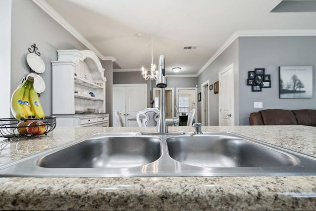 589 Smoky Mountains Dr, Gallatin, TN 37066 - kitchen with crown molding, a chandelier, a sink, light countertops, and open shelves