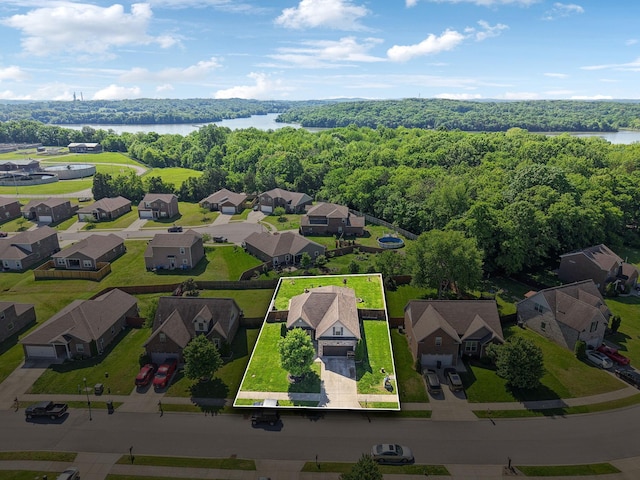 589 Smoky Mountains Dr, Gallatin, TN 37066 - aerial view of residential area with property boundaries highlighted, a heavily wooded area, and a nearby body of water
