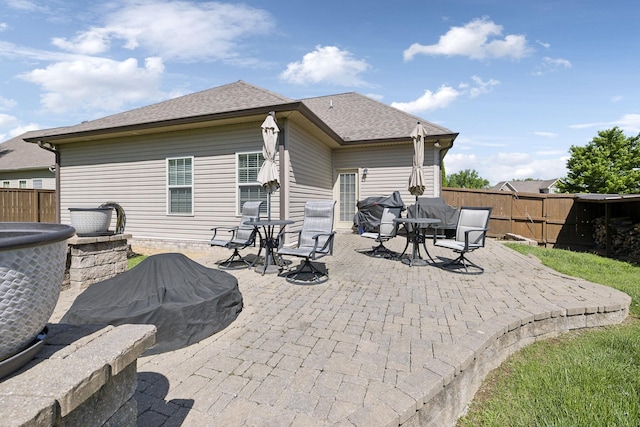 589 Smoky Mountains Dr, Gallatin, TN 37066 - rear view of house featuring a fenced backyard, a patio area, and roof with shingles