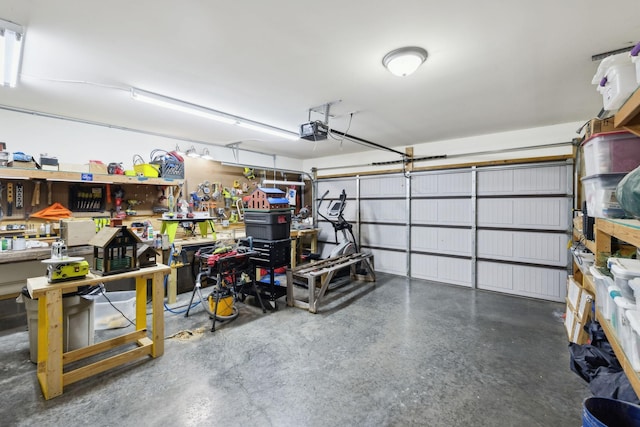 589 Smoky Mountains Dr, Gallatin, TN 37066 - garage with a garage door opener and a workshop area