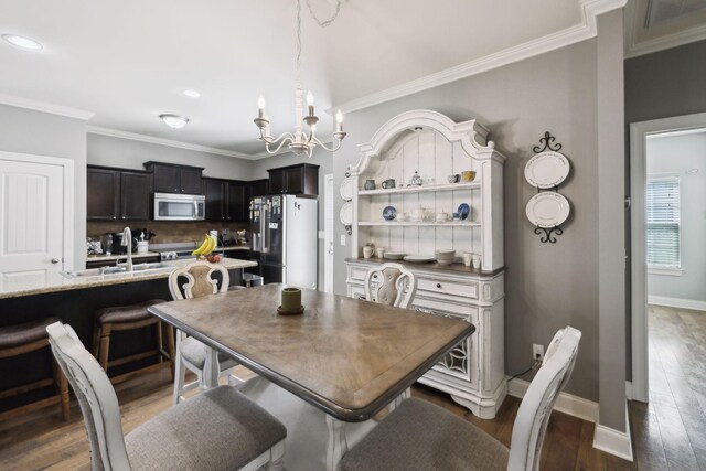 589 Smoky Mountains Dr, Gallatin, TN 37066 - dining area featuring crown molding, a chandelier, wood finished floors, baseboards, and recessed lighting
