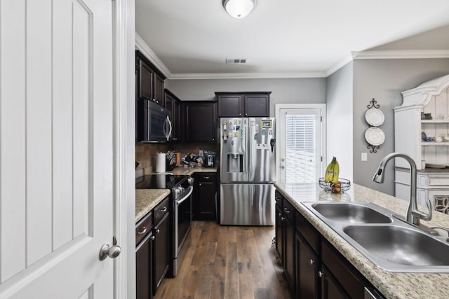 589 Smoky Mountains Dr, Gallatin, TN 37066 - kitchen featuring appliances with stainless steel finishes, a sink, dark wood-style flooring, ornamental molding, and light countertops