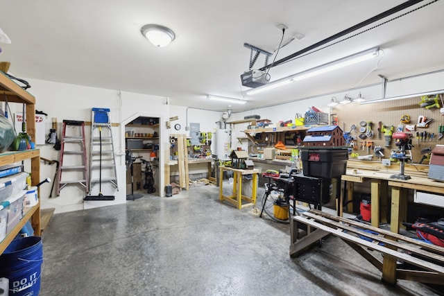 589 Smoky Mountains Dr, Gallatin, TN 37066 - garage featuring a workshop area, a garage door opener, and water heater