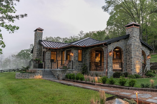 5564 Wilkins Branch Rd, Franklin, TN 37064 - back of property with a chimney, a standing seam roof, stone siding, metal roof, and a porch