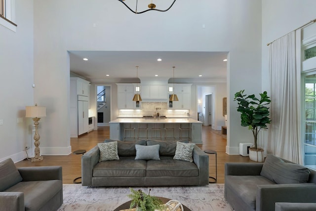 1461 Witherspoon Dr, Brentwood, TN 37027 - living area with a towering ceiling, wood finished floors, recessed lighting, baseboards, and healthy amount of natural light