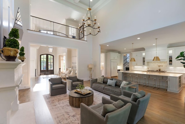 1461 Witherspoon Dr, Brentwood, TN 37027 - living area featuring wood finished floors, a high ceiling, recessed lighting, crown molding, and baseboards