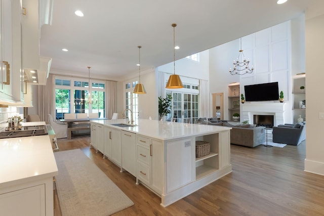 1461 Witherspoon Dr, Brentwood, TN 37027 - kitchen with a sink, a chandelier, white cabinets, light countertops, and recessed lighting