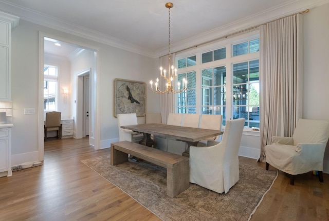 1461 Witherspoon Dr, Brentwood, TN 37027 - dining room featuring a chandelier, crown molding, light wood-style floors, and baseboards