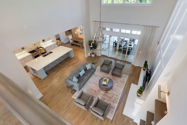 1461 Witherspoon Dr, Brentwood, TN 37027 - living area featuring a high ceiling, stairway, and wood finished floors
