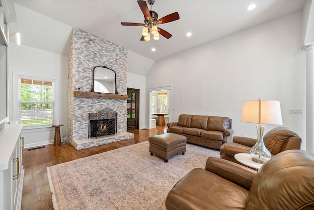 3031 Trice Pl, Lebanon, TN 37087 - living room featuring a stone fireplace, wood finished floors, a ceiling fan, lofted ceiling, and recessed lighting