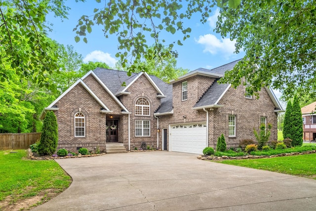 3031 Trice Pl, Lebanon, TN 37087 - view of front facade with concrete driveway, brick siding, roof with shingles, and a garage