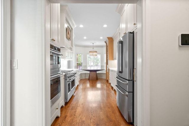 3031 Trice Pl, Lebanon, TN 37087 - kitchen with appliances with stainless steel finishes, white cabinetry, recessed lighting, light wood finished floors, and light countertops