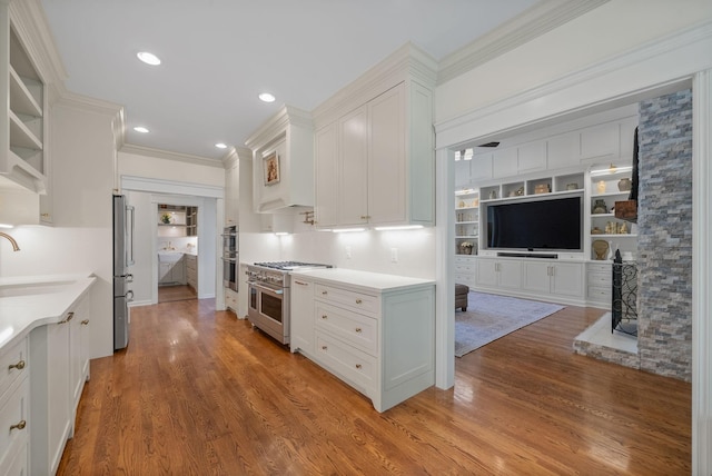 3031 Trice Pl, Lebanon, TN 37087 - kitchen featuring stainless steel appliances, a sink, white cabinets, open shelves, and light countertops