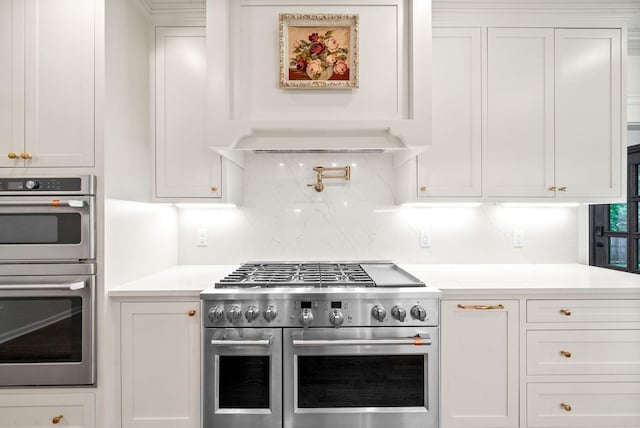 3031 Trice Pl, Lebanon, TN 37087 - kitchen featuring stainless steel appliances, decorative backsplash, light countertops, and white cabinetry